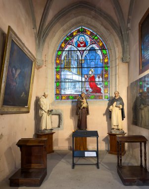 A stained glass window and chapel in Grenoble cathedral, France,  representing 