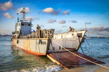 The LC13 Mbono, a Tanzanian navy landing craft on the beach in Stone Town, Zanzibar, Tanzania. clipart