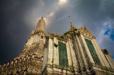 The spires of Wat Arun, or the Temple of Dawn, in Bangkok, Thailand seen from the rear. clipart