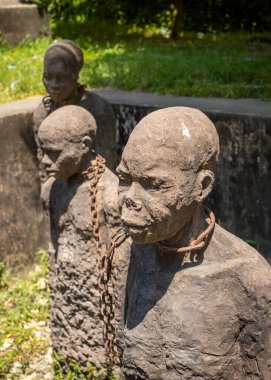 The memorial sculpture to slaves by Swedish artist Clara Sornas at the old Slave Market, Stone Town, Zanzibar, Tanzania clipart