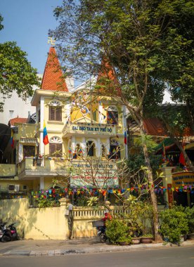 The Cao Dai Oratory, or temple, in Hanoi, Vietnam. Cao Dai is a colourul syncretic religion established in Southern Vietnam in 1927 and headquartered in the town of Tay Ninh. clipart