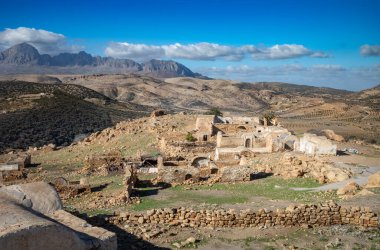 Ruined buildings in the abandoned hilltop Berber village called Zriba El Alia (Zriba Olia) in Tunisia clipart