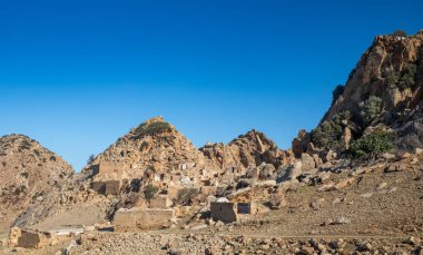 Naturally camoflaged ruins at the abandoned hilltop Berber village called Zriba El Alia (Zriba Olia) in Tunisia clipart