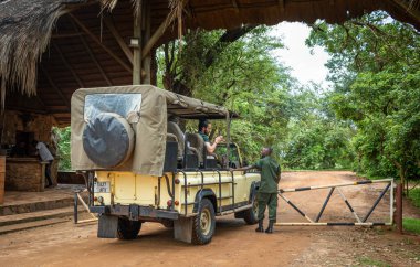 A park ranger stands at the Mtemere entrance to Nyerere National Park (Selous Game Reserve) in Tanzania. clipart