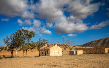 An abandoned and derelict farm house and small holding in Ain El Batria, Tunisia clipart