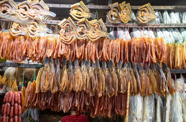 Stock image Dried fish and meat hanging on display at a stall in Siem Reap Market, Cambodia.