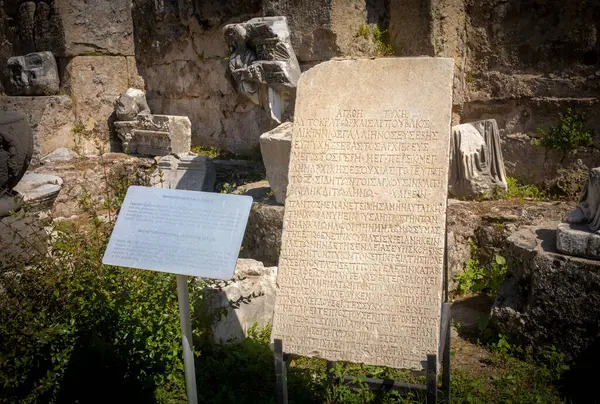 stock image An inscribed stone tablet in the courtyard of Side museum in Side, Antalya province, Turkey (Turkiye).