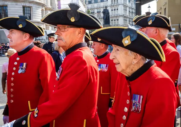 stock image Chelsea pensioners wait at the entrance to Horse Guards Parade in Whitehall, London, to be admitted to a VIP area for Queen Elizabeth's Platinum Jubilee celebrations on 2 June 2022