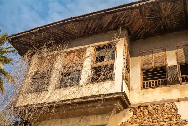 stock image A dilapidated Ottoman-style house in Antalya's Kaleici old town reveals the faded glory of a bygone era. 