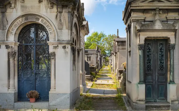 stock image Rows of elaborate 19th century catholic family tombs in the famous Pere Lachaise Cemetery in Paris, France.