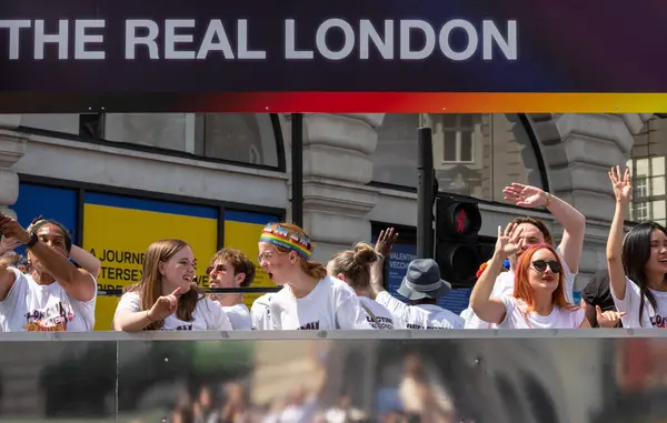 stock image London / UK - Jun 29 2024: University students on a float at the annual Pride in London parade. The celebration brings together people from LGBTQ+ communities.