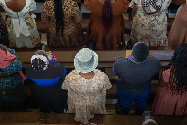 stock image A woman with a silver hat in the congregation at catholic Sunday Mass in St Joseph's Cathedral, Stone Town, Zanzibar, Tanzania