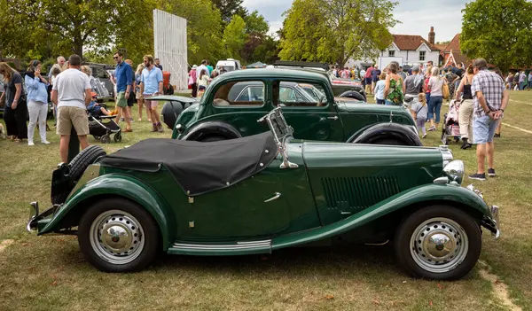 stock image A vintage post-WW2 MG TD Midget two-seat roadster sports car on display at Wisborough Green Village Fete in West Sussex, UK.