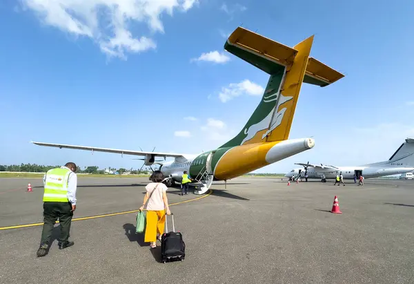 stock image Passengers board a plane for a domestic flight at Zanzibar airport, Zanzibar, Tanzania