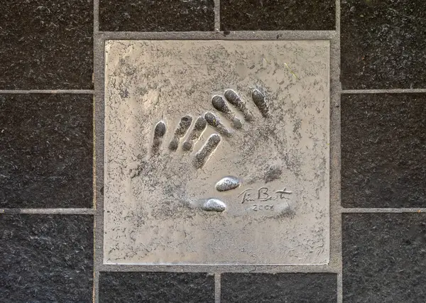 stock image The handprint from famous American filmmaker, artist, and writer Tim Burton set into the pavement of The Alle des toiles (Avenue of the Stars) in Cannes, France. 