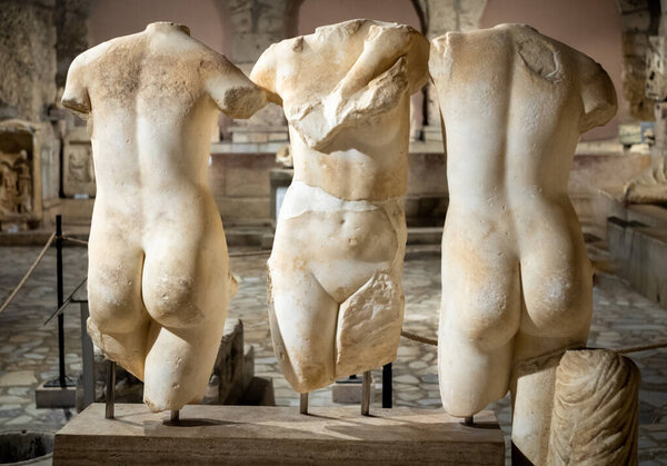 The carved marble torsos of three goddess figures known as the Three Charites or Kharites (Three Graces). 