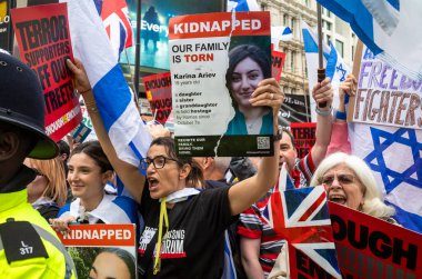 London, UK. 18 May 2024: Pro-Israel counter demonstrators at Piccadilly Circus shout at and taunt people marching for peace in Palestine at  the Nakba 76 March for Palestine against Israeli attacks on Gaza in central London, UK.  clipart