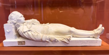 A plaster sculpture of Jacobin leader during the French Revolution Maximilien Robespierre wounded on  27 July 1794 by Max Claudet c1870. clipart