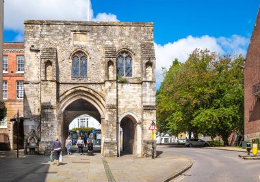 The historic medieval fortified Westgate, which houses a museum, located at the top of the High Street in Winchester, Hampshire, UK clipart