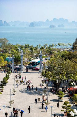 Vietnamese families at lunar new year visit the 17th century Buddhist Cua Ong Temple, in Cam Pha, Quang Ninh, Vietnam. It is dedicated to Tran Quoc Tang and is one of the most sacred temples in Vietnam. clipart