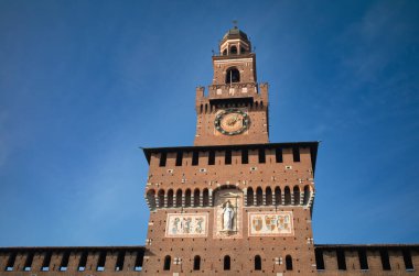 The 15th century Filarete Tower above the entrance gate to Castello Sforzesco, or Milan Castle, in the heart of Milan, Italy. clipart