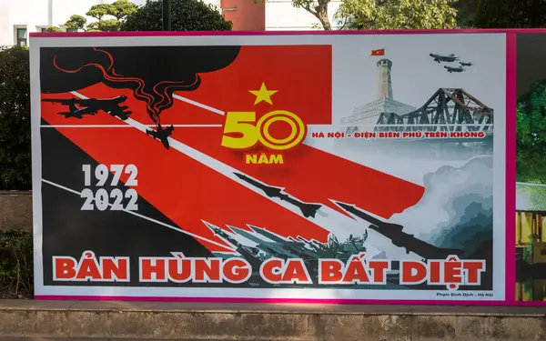 Stock image A Communist party propaganda poster in front of the Hanoi People's Committee building in the centre of the Vietnamese capital city.