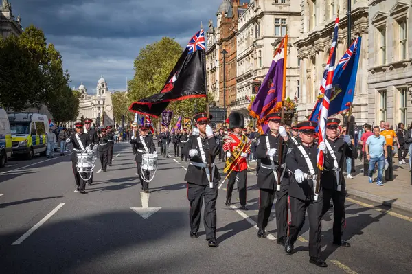 stock image Members of an Irish protestant loyalist paramilitary Ulster Volunteer Force (UVF) band march past the Cenotaph war memorial in Whitehall, London