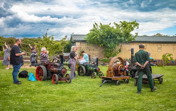 stock image Enthusiasts admire each others' steam popwered traction engines at South Downs Steam Railway, Pulborough, West Sussex, UK.