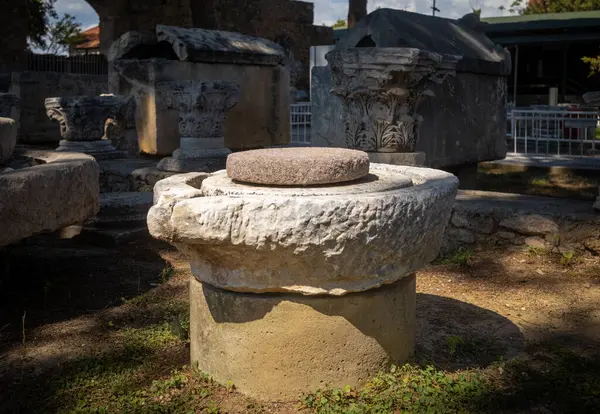 stock image A Roman era stone for grinding olives to release olive oil on display on display in the courtyard at Side Museum in Antalya Province, Turkey (Turkiye)