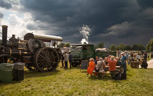 stock image Storrington / UK - Jul 13 2024: A vintage steam traction engines and  steam trucks on display at Sussex Steam Rally.