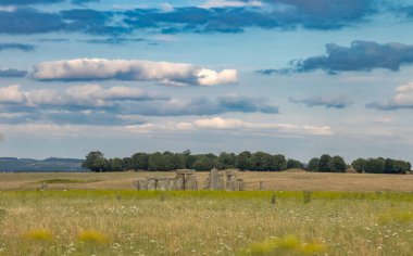 Looking west towards Stonehenge, the prehistoric stone circle monument on Salisbury Plain that is maintained by English Heritage, England, UK. clipart