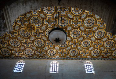 The 17th century wooden coffered ceiling in Otranto Cathedral, Apulia, Italy. It is divided into panels with each containing intricate decorative carvings decorated with gold leaf. clipart