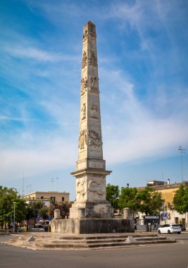 The 1769 Obelisk of Naples Gate in the ancient city of Lecce, Apulia, Italy. It was designed by Giuseppe Zimbalo and built to commemorate the visit of King Ferdinand IV of Bourbon to Lecce. clipart