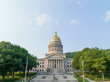 The 293-foot gold atop the capitol is five feet taller than the dome of the United States Capitol.  The dome is covered in copper and gold leaf. The dome was originally gilded by Mack Jenney and Tyler Company in 1931. clipart