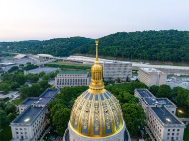 The 293-foot gold atop the capitol is five feet taller than the dome of the United States Capitol.  The dome is covered in copper and gold leaf. The dome was originally gilded by Mack Jenney and Tyler Company in 1931. clipart