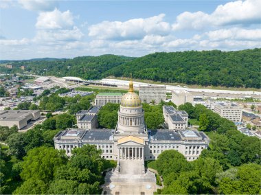 The 293-foot gold atop the capitol is five feet taller than the dome of the United States Capitol.  The dome is covered in copper and gold leaf. The dome was originally gilded by Mack Jenney and Tyler Company in 1931. The dome was restored to the ori clipart