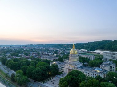 The 293-foot gold atop the capitol is five feet taller than the dome of the United States Capitol.  The dome is covered in copper and gold leaf. The dome was originally gilded by Mack Jenney and Tyler Company in 1931. clipart