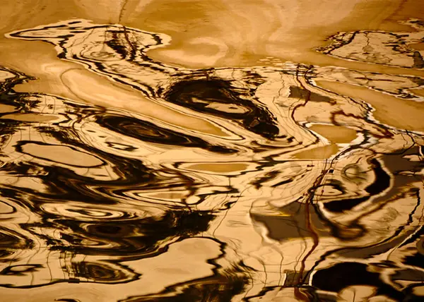 Reflection of brown and yellow in lines in the Golden Horn...