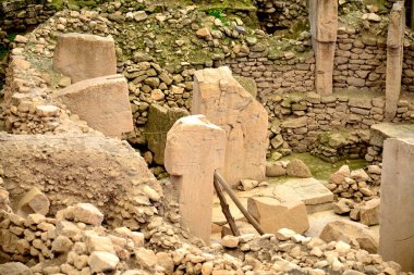 Gobekli Tepe is an archaeological site, located about 18 km northeast of the city of anlurfa in present-day Turkey. A complex of stone buildings dated to the 10th millennium BC was found there.