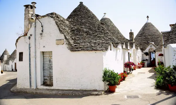 stock image Alberobello is a city in Puglia, Italy. It is known for the Trulli, white conical stone buildings, present by the hundreds in the hilly district of Rione Monti.