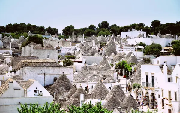 stock image Alberobello is a city in Puglia, Italy. It is known for the Trulli, white conical stone buildings, present by the hundreds in the hilly district of Rione Monti.