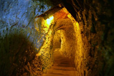 TURKEY,DERINKUYU The mysterious underground city dates back to the 8th-7th century BC. it extends 85 m deep on eight different levels and could accommodate a population of 20,000 people clipart