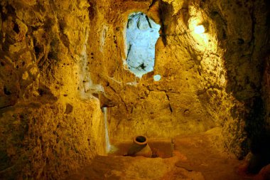 TURKEY,DERINKUYU The mysterious underground city dates back to the 8th-7th century BC. it extends 85 m deep on eight different levels and could accommodate a population of 20,000 people clipart