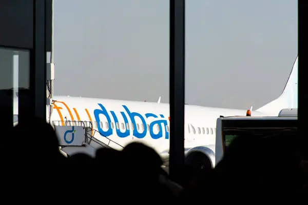 stock image A fly Dubai Boeing 737-800 aircraft at Dubai International Airport Terminal 2.