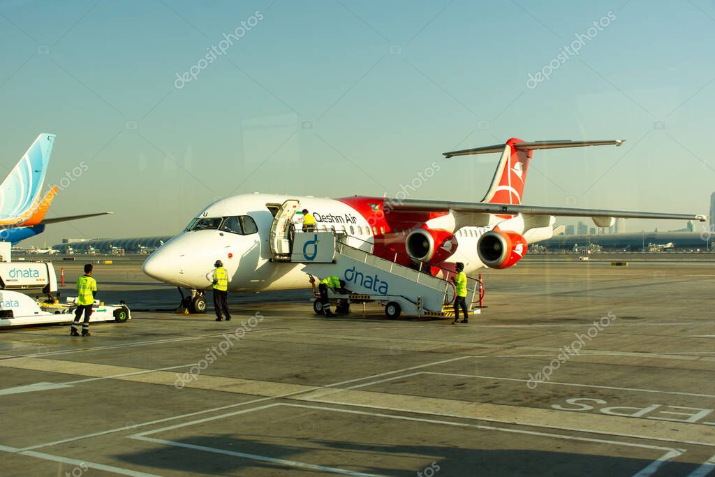 A Qeshm Air aircraft at Dubai International Airport runway, UAE.
