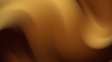 Kahverengi ve sarı tonların karışımından oluşan soyut bulanıklık, sıcak, dünyevi renkler gerektiren arka plan veya tasarımlar için idealdir..