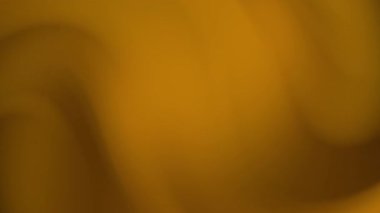 Pürüzsüz dalga eğimleri ve ince derinliği olan lüks bir altın soyut arka plan. Zarif markalaşma, lüks tasarım projeleri, sunumlar, paketleme ve dijital arayüzler için mükemmel