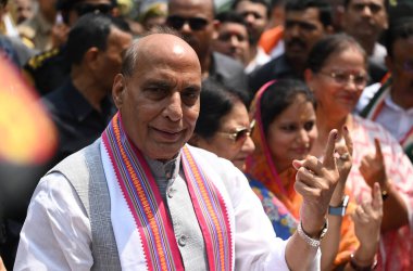 LUCKNOW, INDIA - MAY 20: Defence Minister of India and BJP Candidate from Lucknow Lok Sabha seat Rajnath Singh shows his inked fingers after casting his vote at Scholar home polling station Gomti Nagar during the fifth phase of Lok Sabha Election  clipart