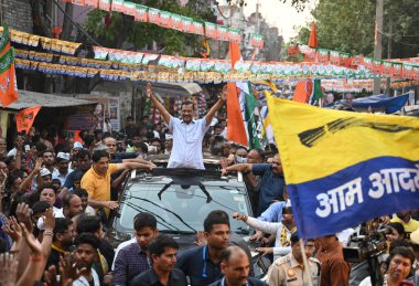 NEW DELHI, INDIA - MAY 15 2024:  Delhi CM Arvind Kejriwal seen during road show as a part of the election campaign for INDIA Alliance Candidate of Congress, JP Aggarwal from Chandni Chowk Constituency for upcoming Loksabha Elections at GT Karnal Road clipart