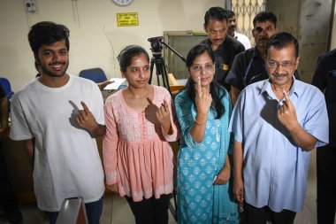 NEW DELHI, INDIA - MAY 25: Arvind Kejriwal, Chief Minister of Delhi along with his family members shows the inked fingers after casting their vote during Loksabha Election Polls at a polling station in Civil Lines on May 25, 2024 in New Delhi, India. clipart